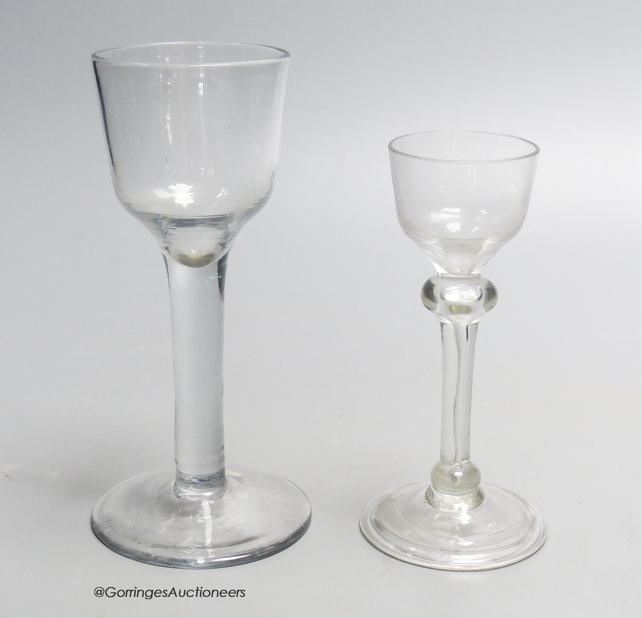 Two Georgian drinking glasses including a light baluster type cordial glass and a plain stem wine glass, tallest 16.5cm